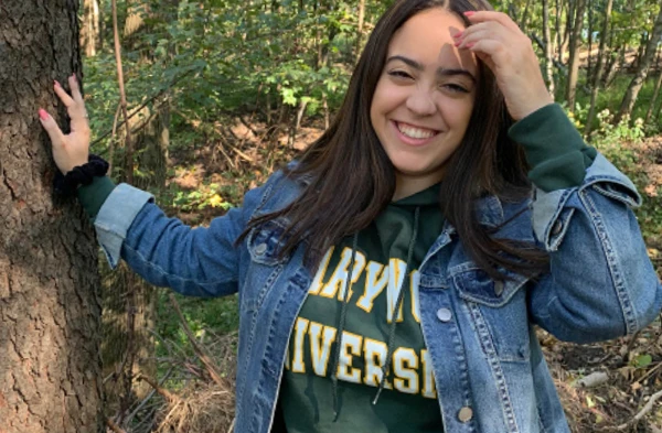 A young woman wearing a jean jacket.